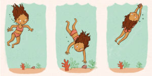A girl dives for a shell and reaches it on her third attempt.